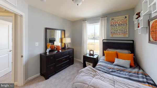 a bedroom with a bed and window