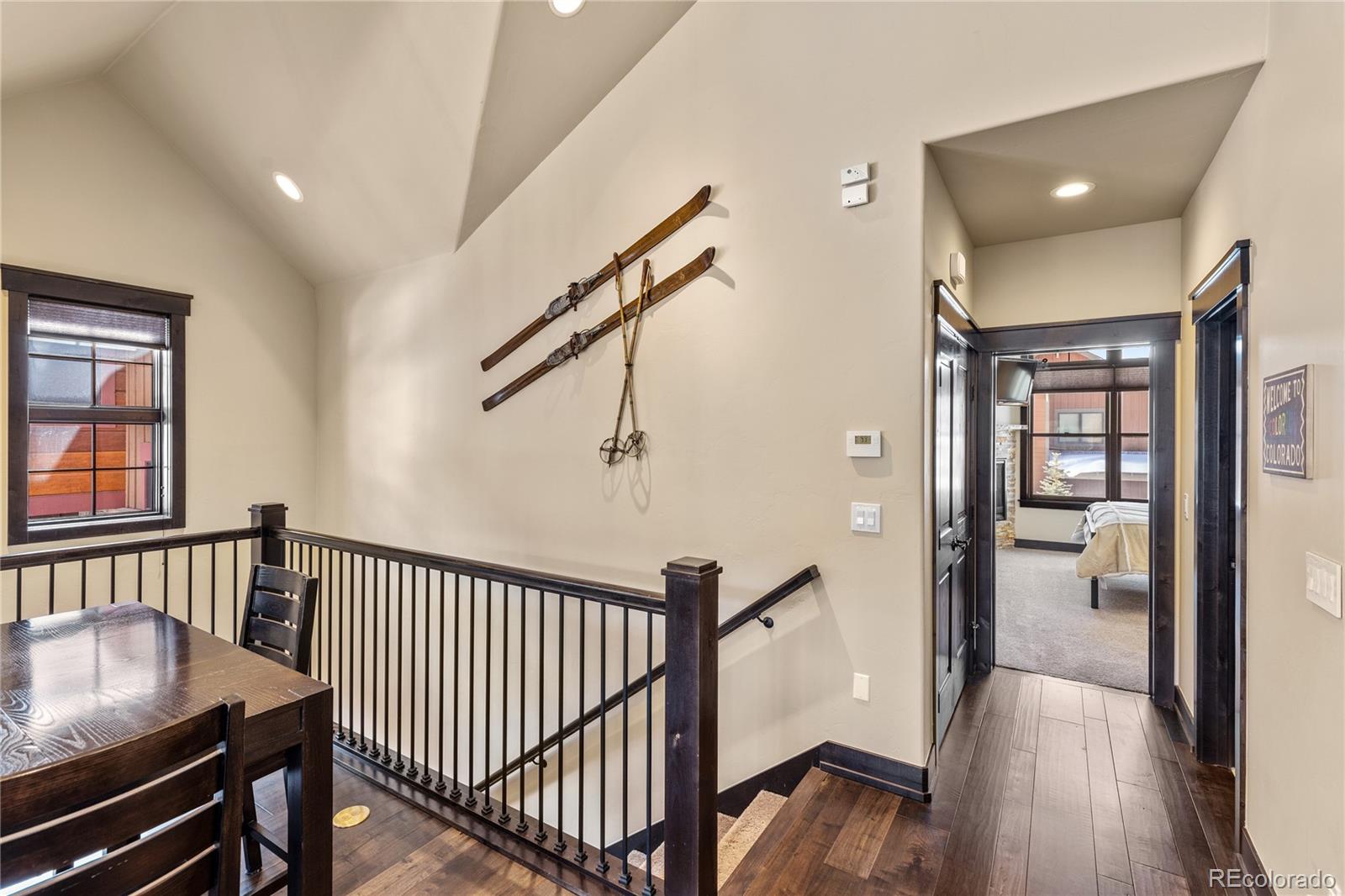 68 Independence Road Keystone, CO 80435 - Photo 13 of 34 a view of a hallway with wooden floor and stairs