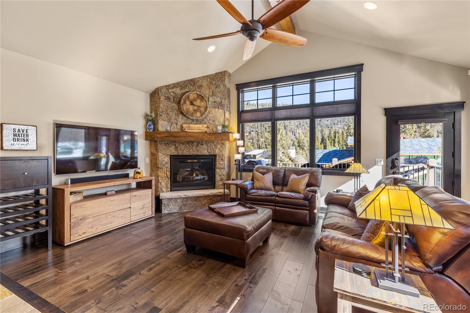 68 Independence Road Keystone, CO 80435 - Photo 2 of 34 a living room with furniture a flat screen tv and a fireplace