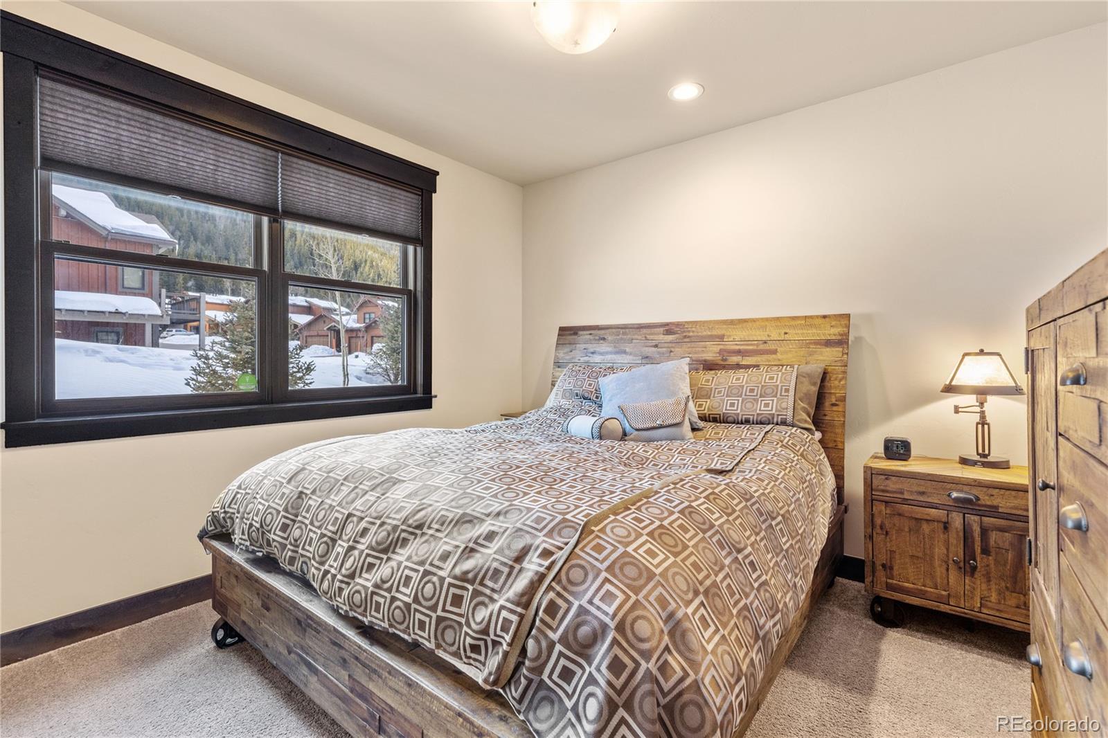 68 Independence Road Keystone, CO 80435 - Photo 27 of 34 a bedroom with a bed and large window