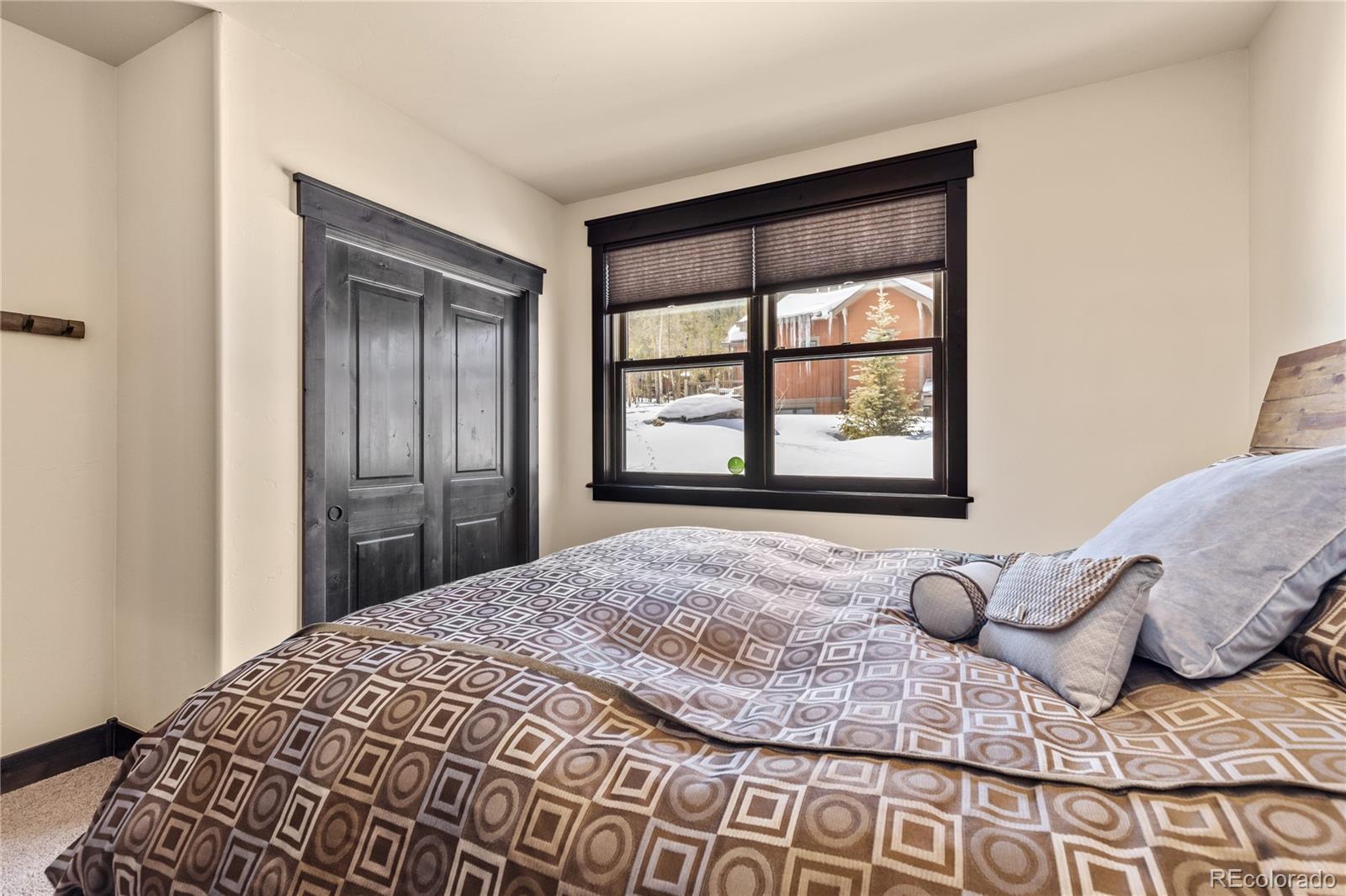 68 Independence Road Keystone, CO 80435 - Photo 28 of 34 a large bed sitting in a bedroom next to a window