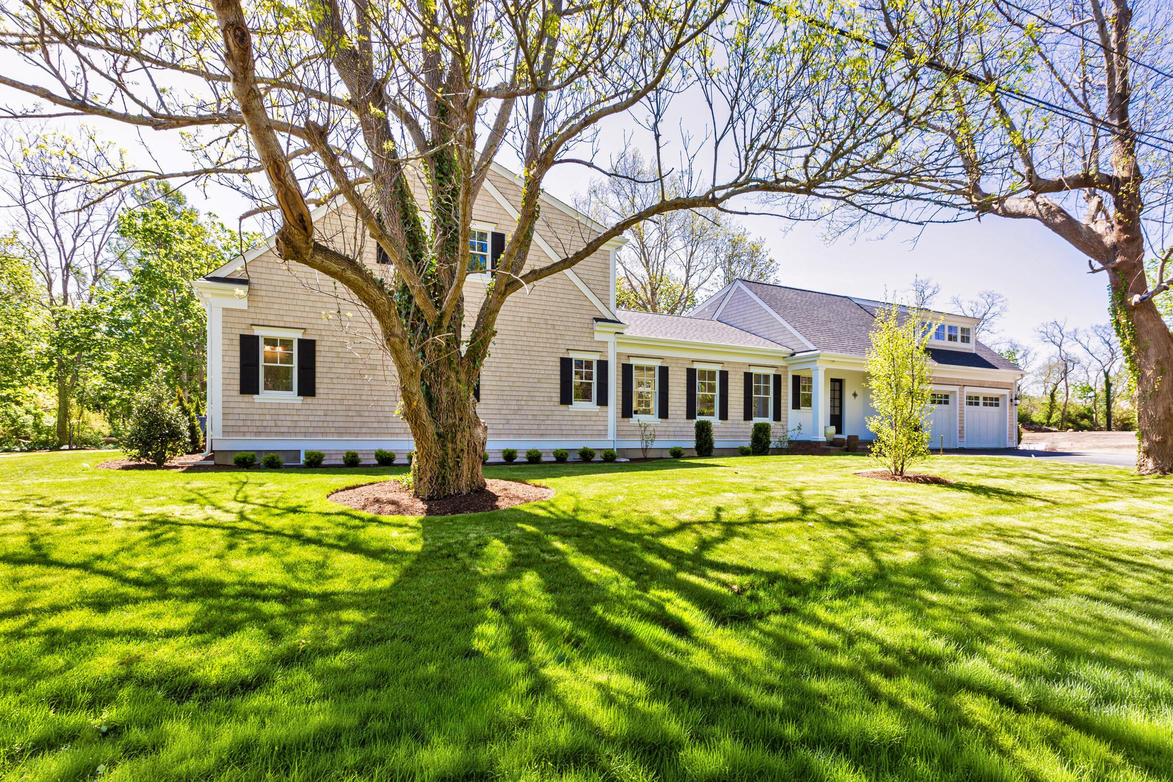 33 Crowell Road Chatham, MA 02633 - Photo 3 of 10 a front view of a house with a garden