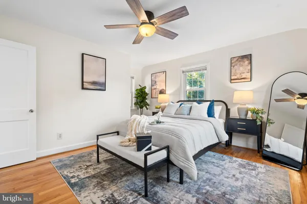 a bed room with a bed and a chandelier