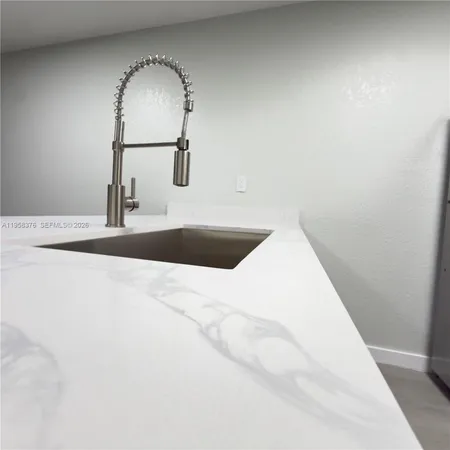 a view of a wooden floor in a bathroom