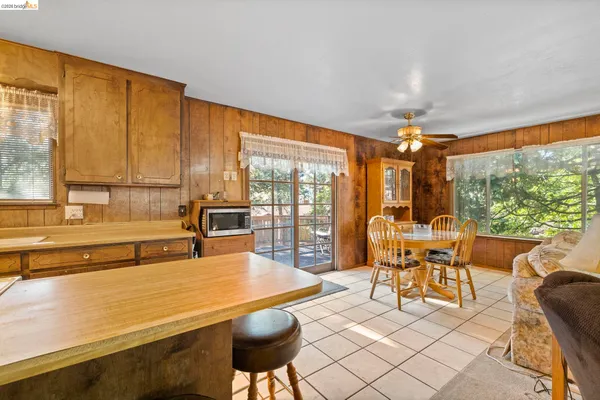 a living room with furniture and large windows