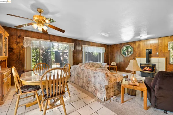 a view of a dining room with furniture wooden floor and chandelier
