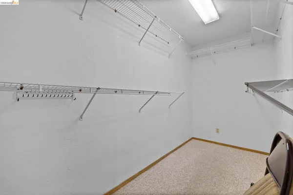 a view of a room with racks on the wall