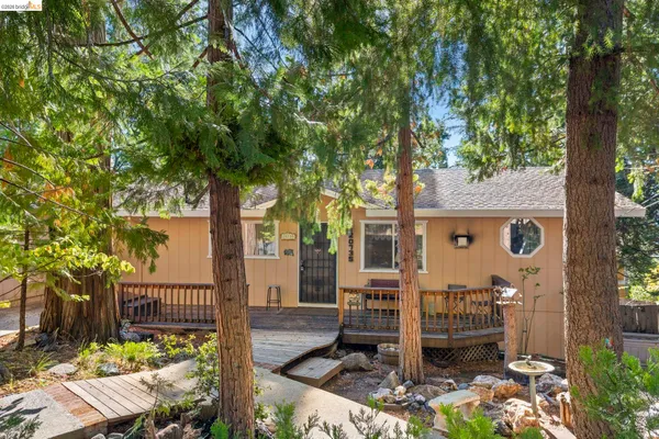 front view of a house with a tree