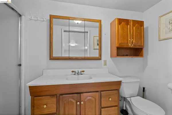 a bathroom with 2 sink and a toilet