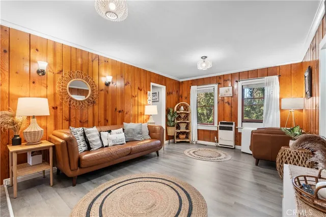 a living room with furniture and large windows