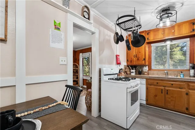 a kitchen with a stove a sink and a microwave