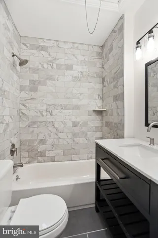 a bathroom with a sink a toilet and a bathtub