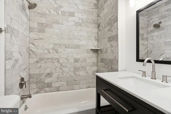 a bathroom with a sink and a bathtub