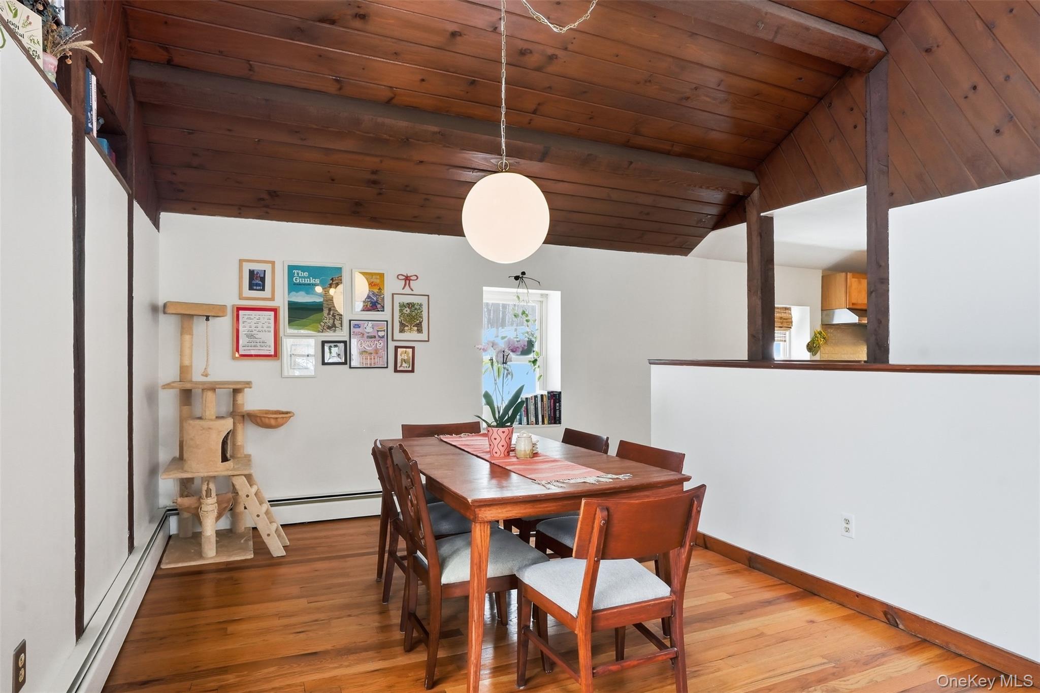 44 Triangle Of Clearwater Road Highland, NY 12528 - Photo 12 of 48 a view of a dining room with furniture and wooden floor