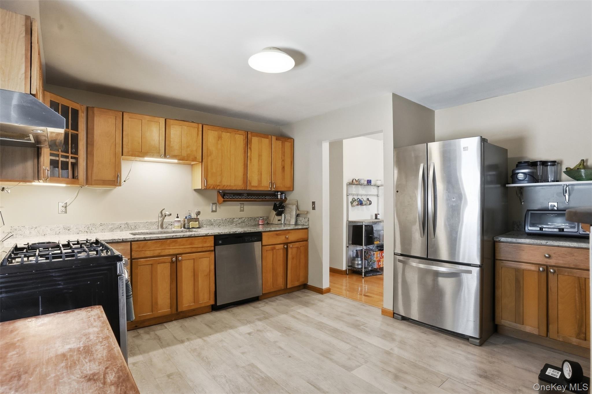 44 Triangle Of Clearwater Road Highland, NY 12528 - Photo 15 of 48 a kitchen with granite countertop stainless steel appliances a sink cabinets and a window
