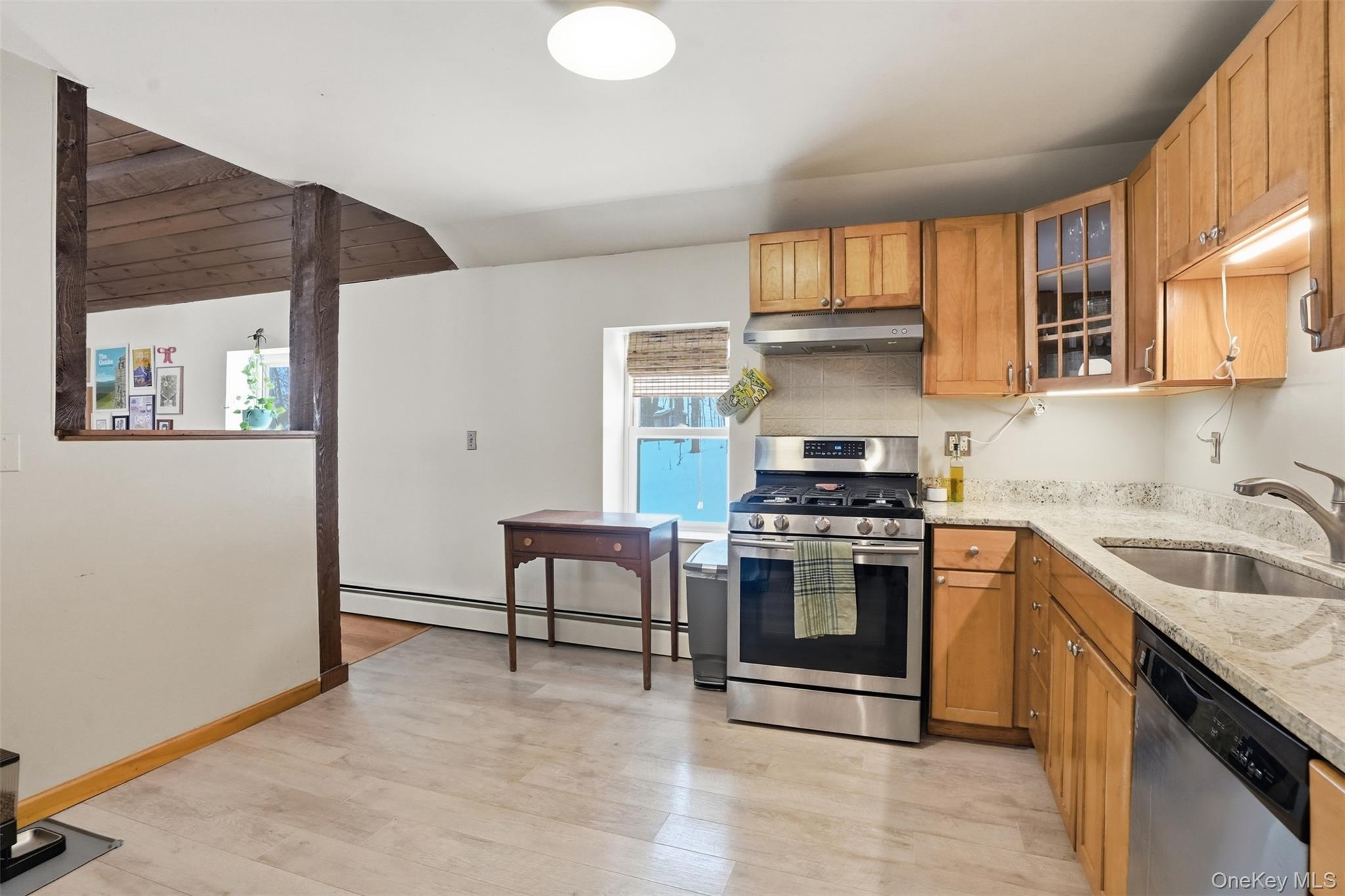 44 Triangle Of Clearwater Road Highland, NY 12528 - Photo 16 of 48 a kitchen with granite countertop a stove and a sink