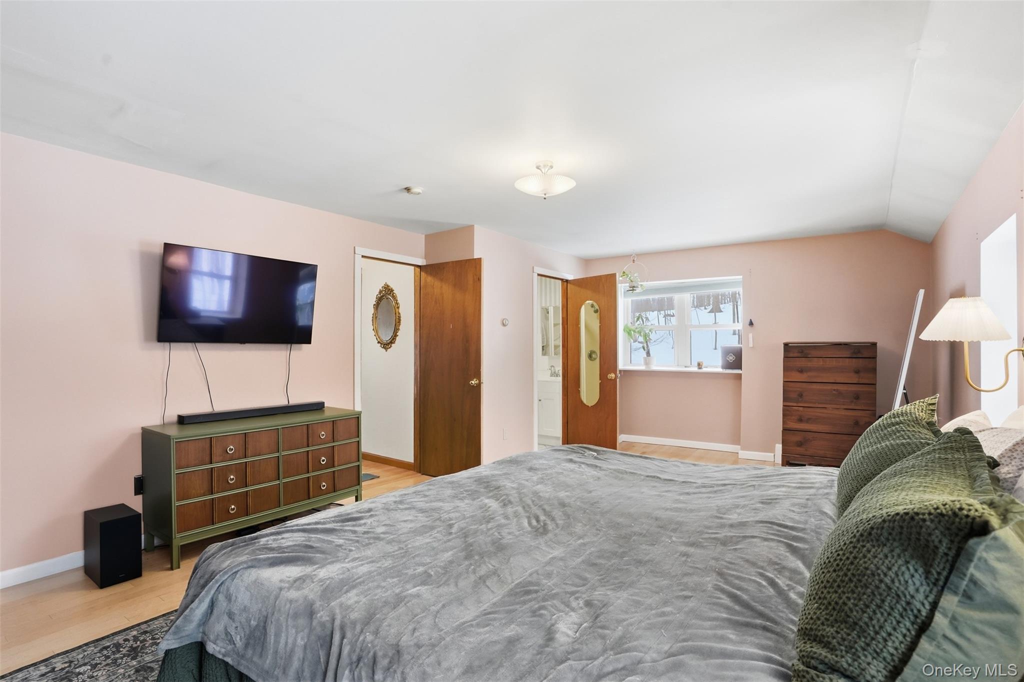 44 Triangle Of Clearwater Road Highland, NY 12528 - Photo 23 of 48 a bedroom with a bed and a flat screen tv