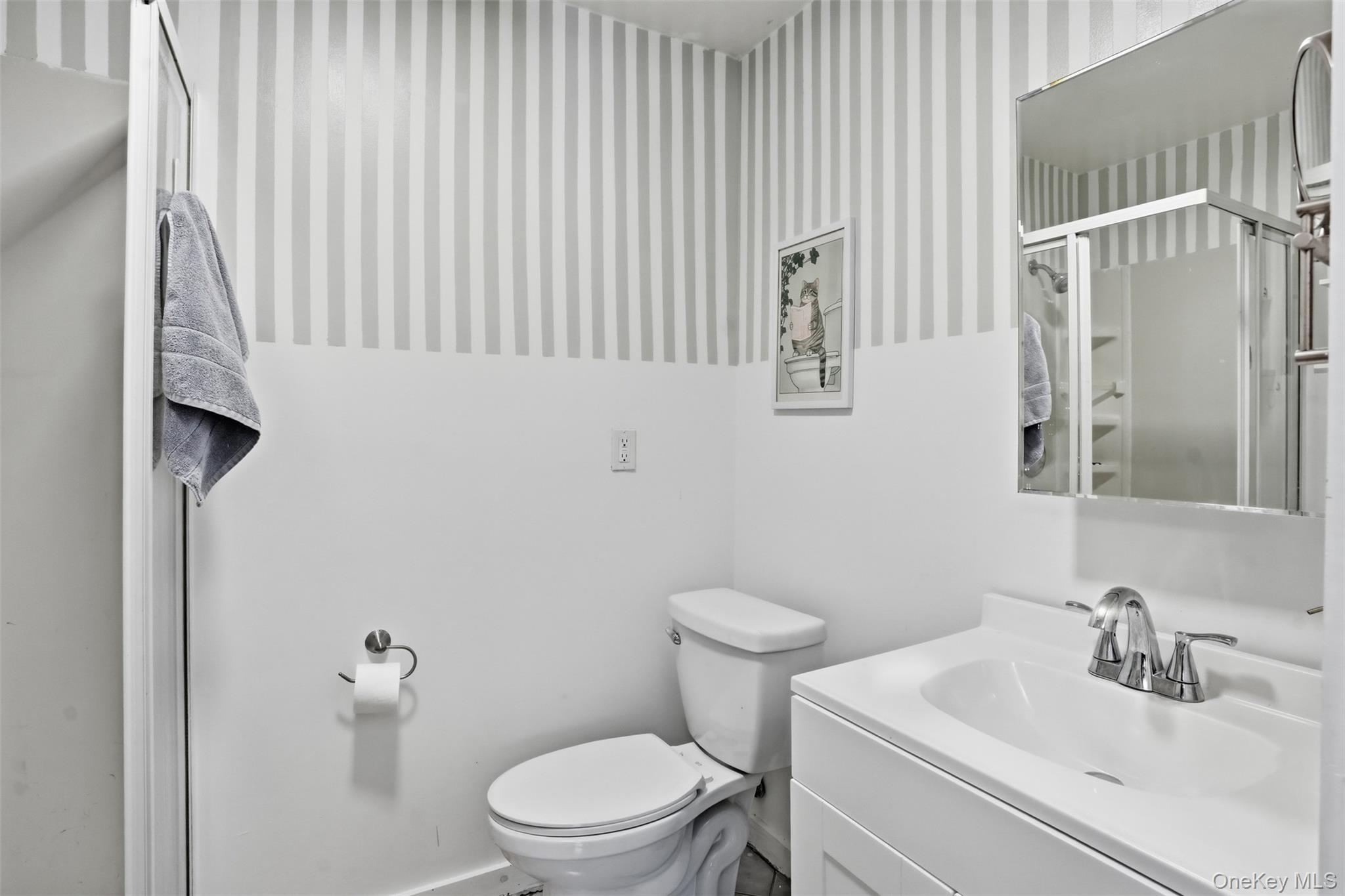 44 Triangle Of Clearwater Road Highland, NY 12528 - Photo 24 of 48 a bathroom with a sink a toilet and shower curtain