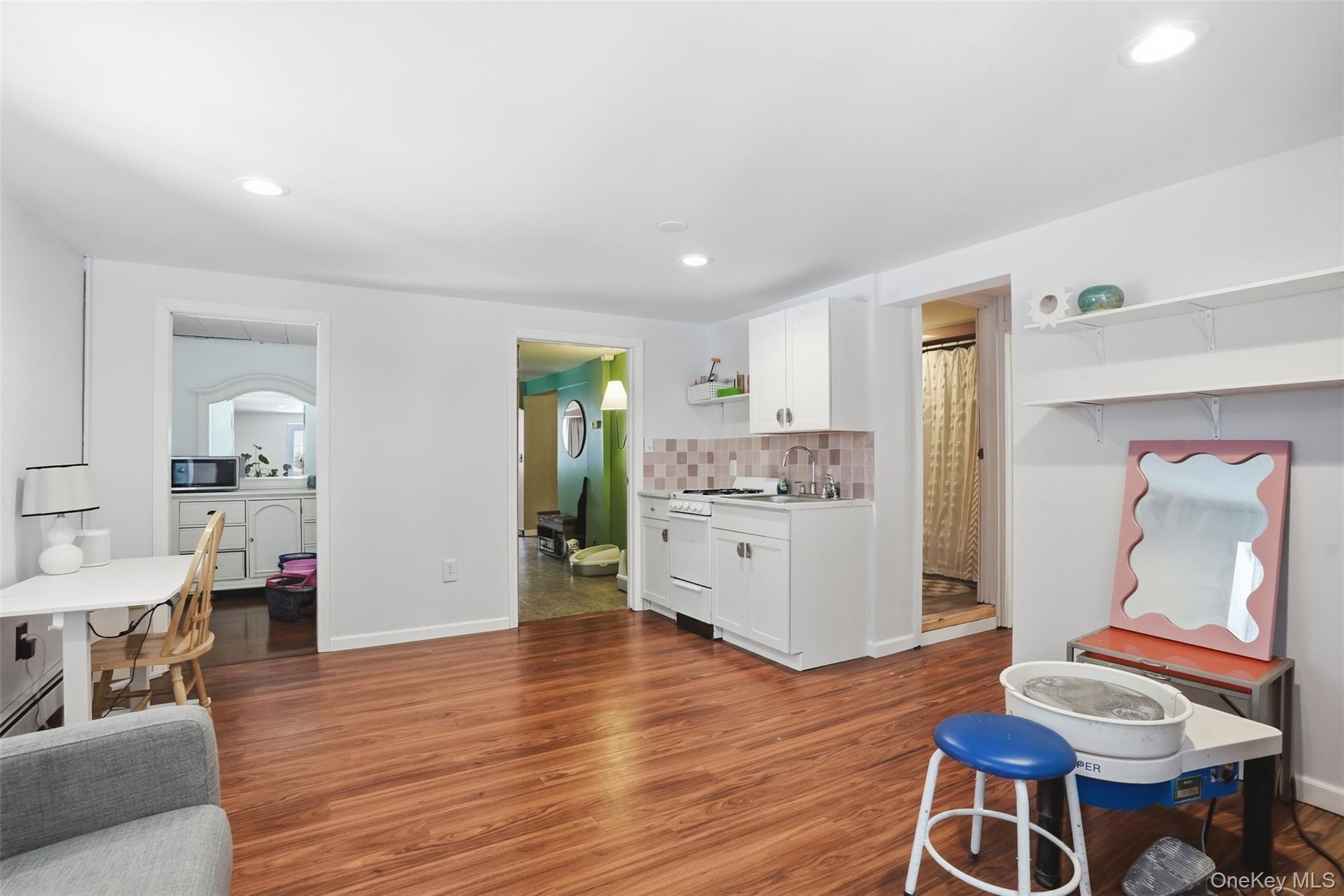 44 Triangle Of Clearwater Road Highland, NY 12528 - Photo 30 of 48 a room with stainless steel appliances kitchen island granite countertop furniture and wooden floor