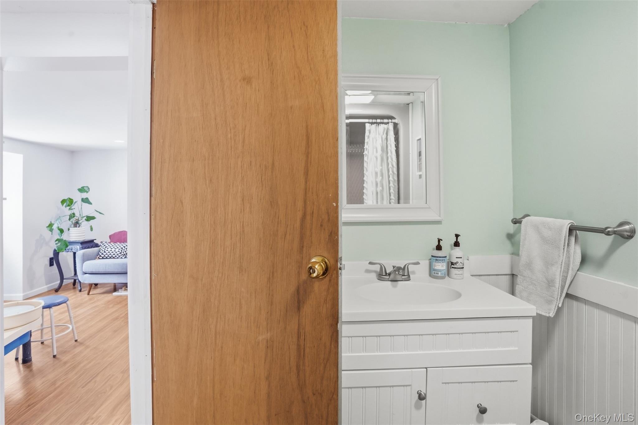 44 Triangle Of Clearwater Road Highland, NY 12528 - Photo 35 of 48 a bathroom with a sink a vanity and a mirror