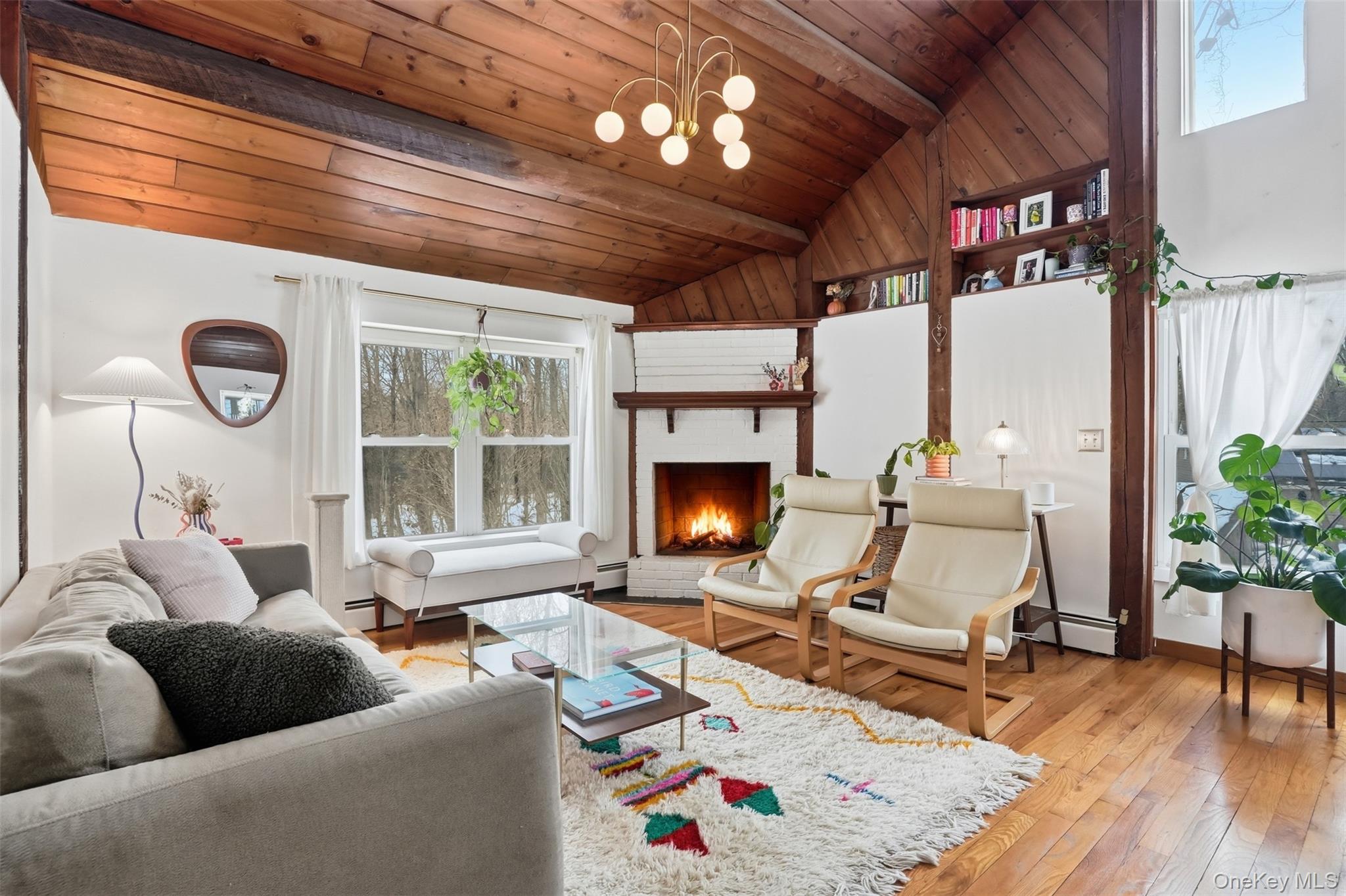 44 Triangle Of Clearwater Road Highland, NY 12528 - Photo 7 of 48 a living room with furniture and a fireplace