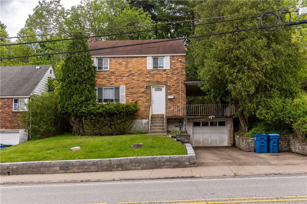 531 Beulah Road Pittsburgh, PA 15235 - Photo 1 of 32 a view of house with a yard and a car park side of the road