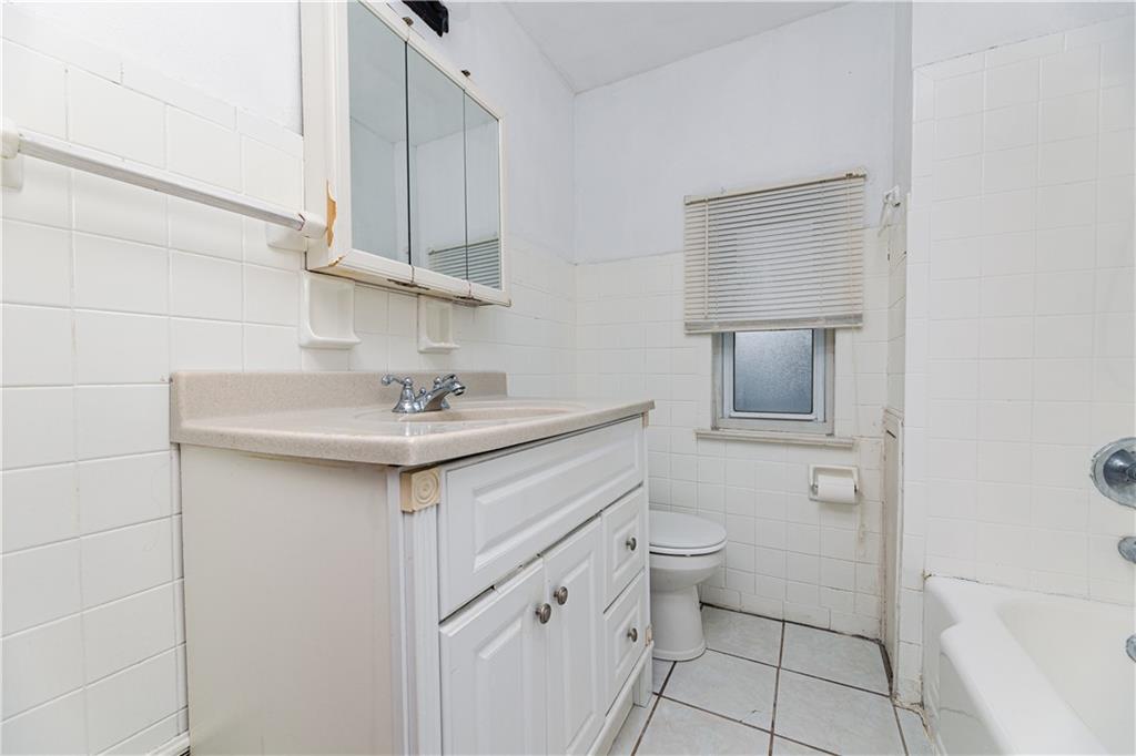 531 Beulah Road Pittsburgh, PA 15235 - Photo 24 of 32 a bathroom with a sink toilet and shower