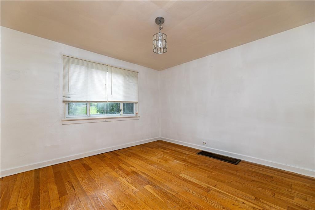 531 Beulah Road Pittsburgh, PA 15235 - Photo 5 of 32 a view of empty room with wooden floor and fan