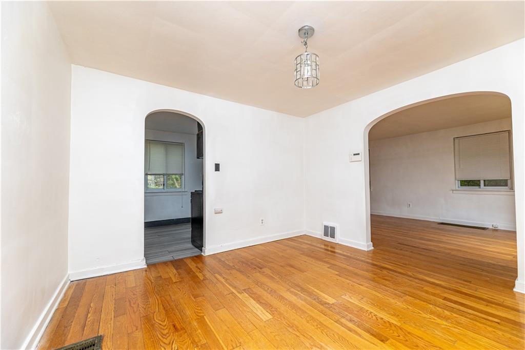 531 Beulah Road Pittsburgh, PA 15235 - Photo 6 of 32 a view of empty room with wooden floor