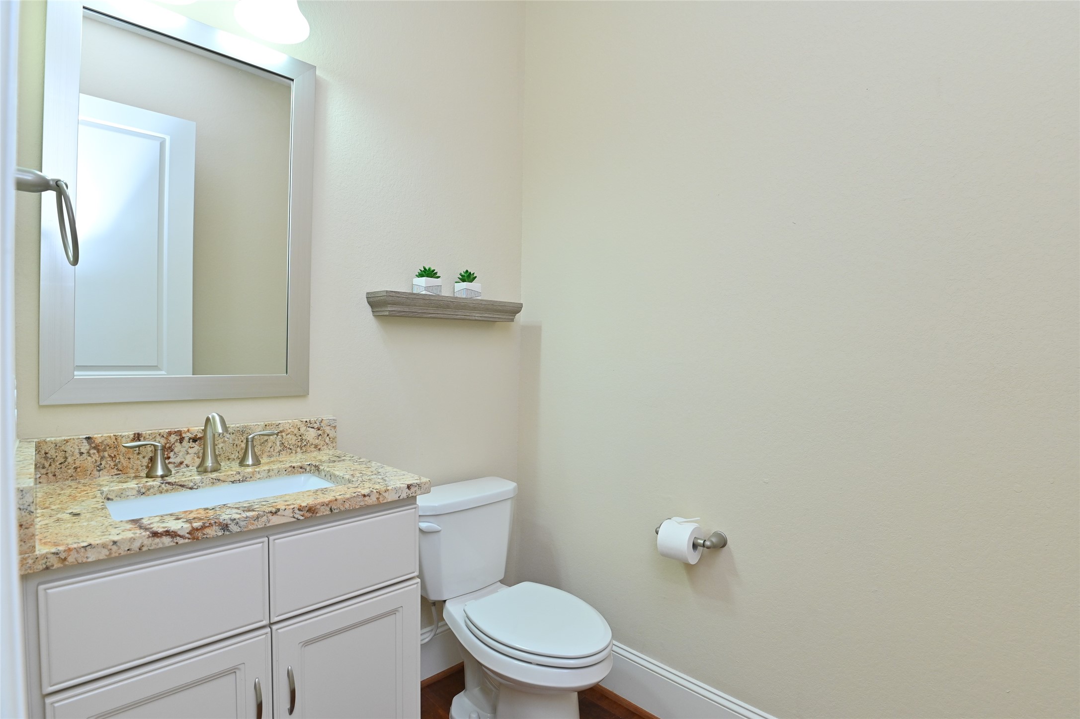 11906 McNabb Lane Houston, TX 77082 - Photo 12 of 45 a bathroom with a granite countertop toilet and a sink