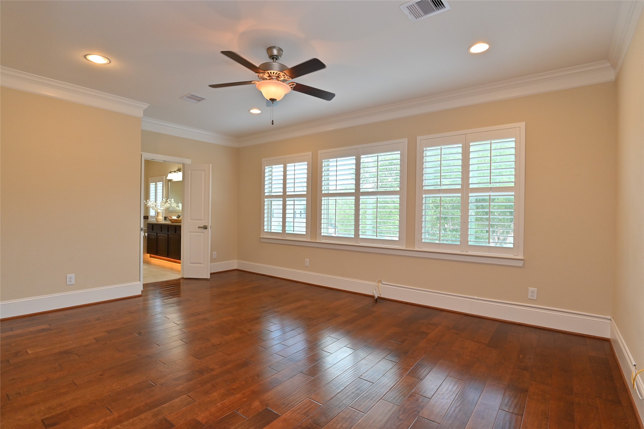 11906 McNabb Lane Houston, TX 77082 - Photo 21 of 45 a view of an empty room with wooden floor and a window