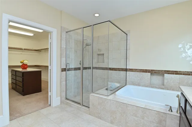 a bathroom with a tub and a shower