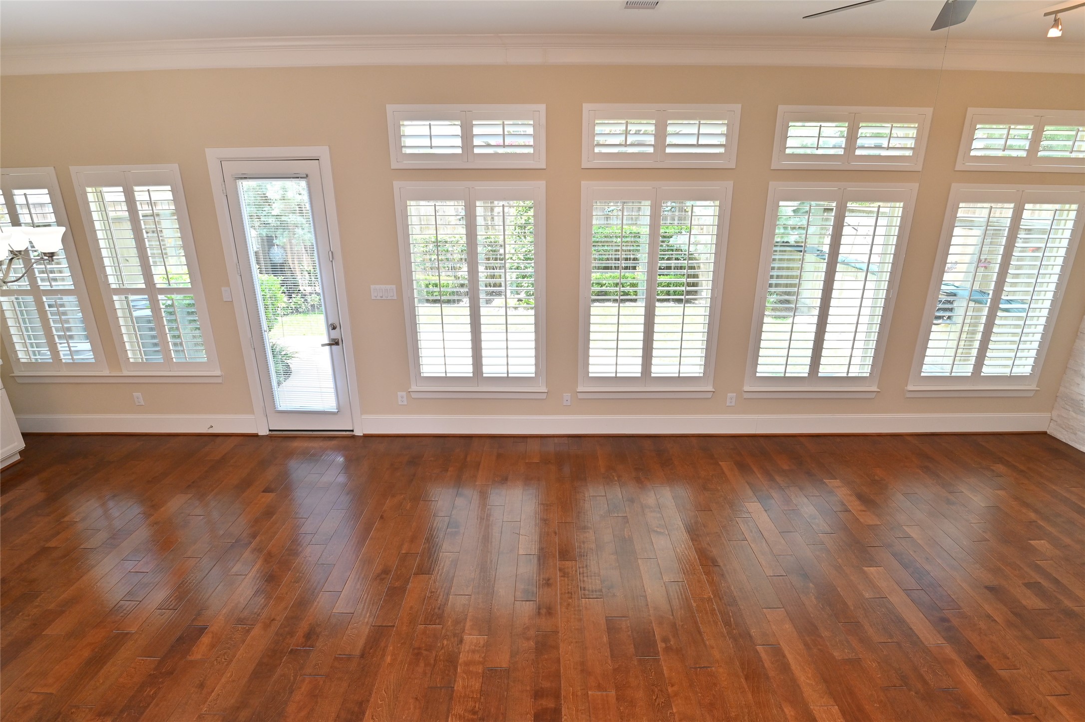 11906 McNabb Lane Houston, TX 77082 - Photo 33 of 45 a view of an empty room with wooden floor and a window