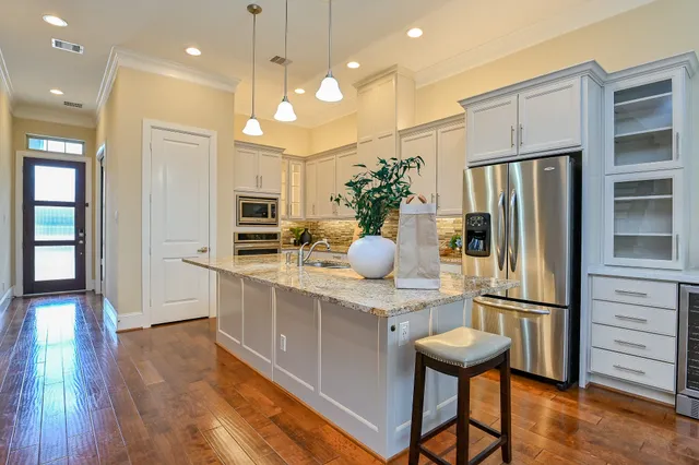 a kitchen with counter top space cabinets and stainless steel appliances