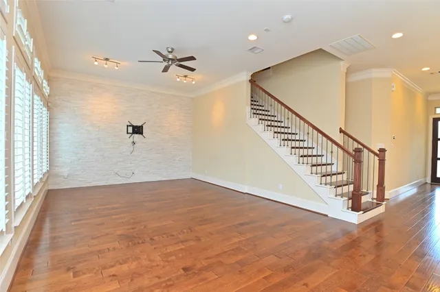 a view of an entryway with wooden floor