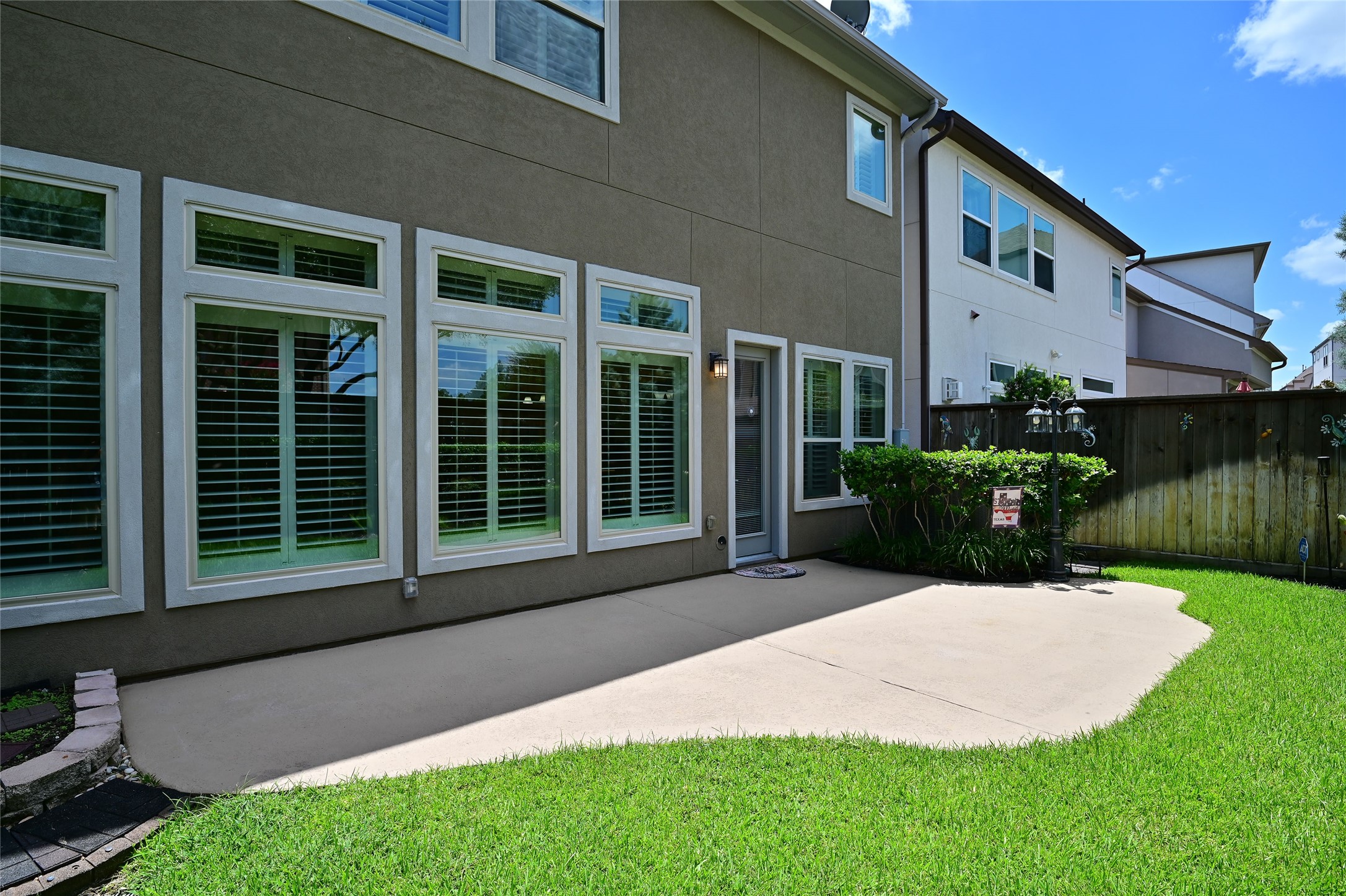 11906 McNabb Lane Houston, TX 77082 - Photo 43 of 45 a front view of a house with garden and porch