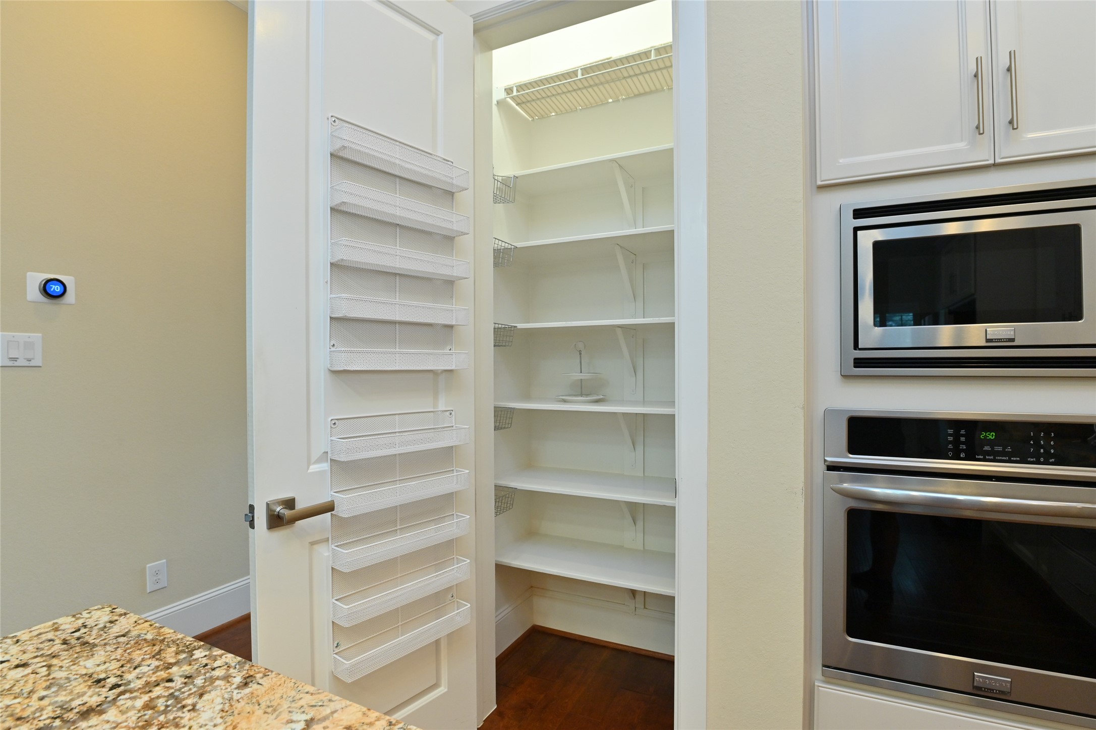 11906 McNabb Lane Houston, TX 77082 - Photo 8 of 45 a kitchen with a stove and a microwave