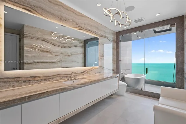 a lobby with furniture and floor to ceiling window