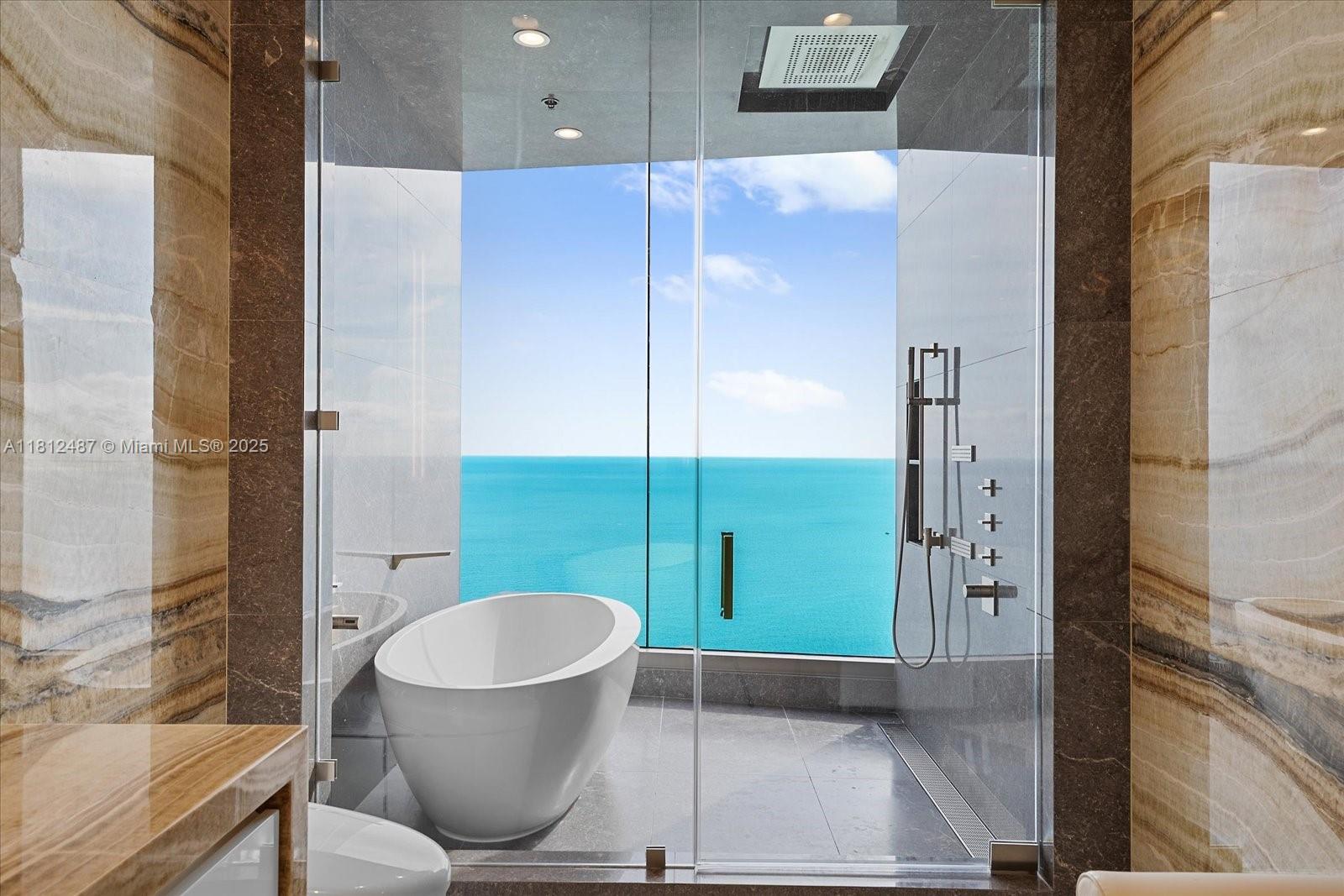 17901 Collins Avenue, Unit 3004 Sunny Isles Beach, FL 33160 - Photo 20 of 61 a bathroom with a toilet and a shower