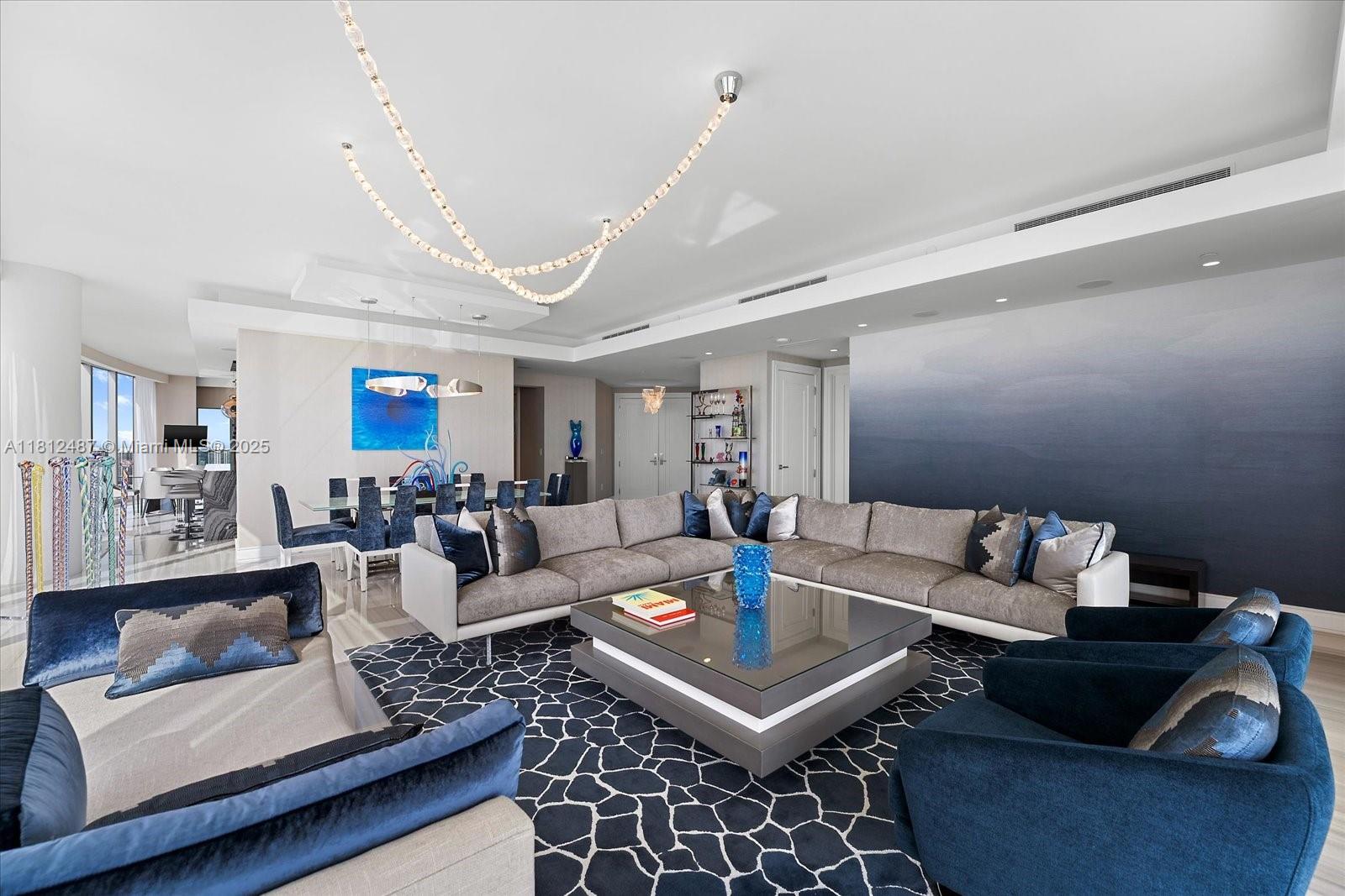 17901 Collins Avenue, Unit 3004 Sunny Isles Beach, FL 33160 - Photo 2 of 61 a living room with furniture and a rug