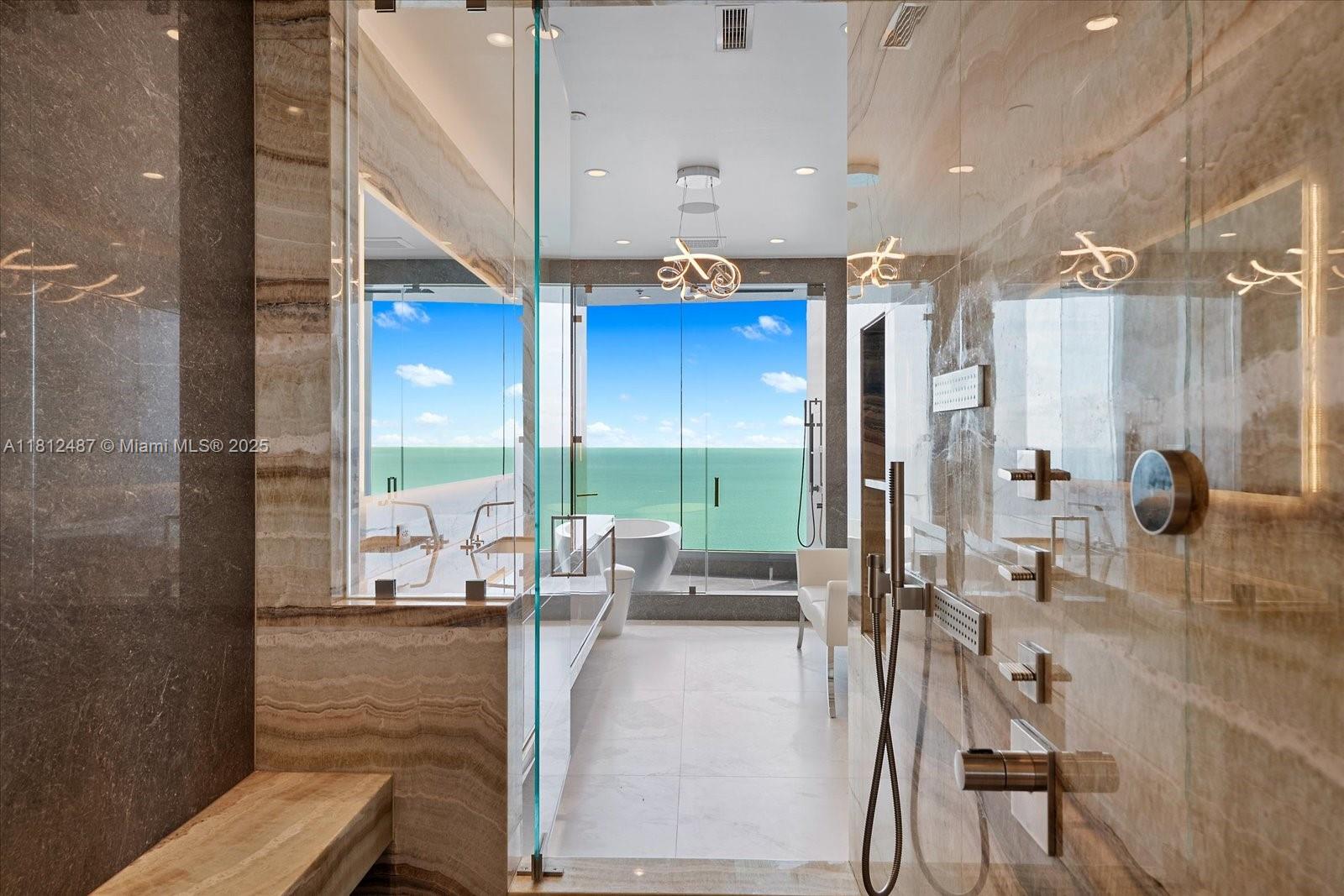 17901 Collins Avenue, Unit 3004 Sunny Isles Beach, FL 33160 - Photo 21 of 61 a lobby with furniture and floor to ceiling window