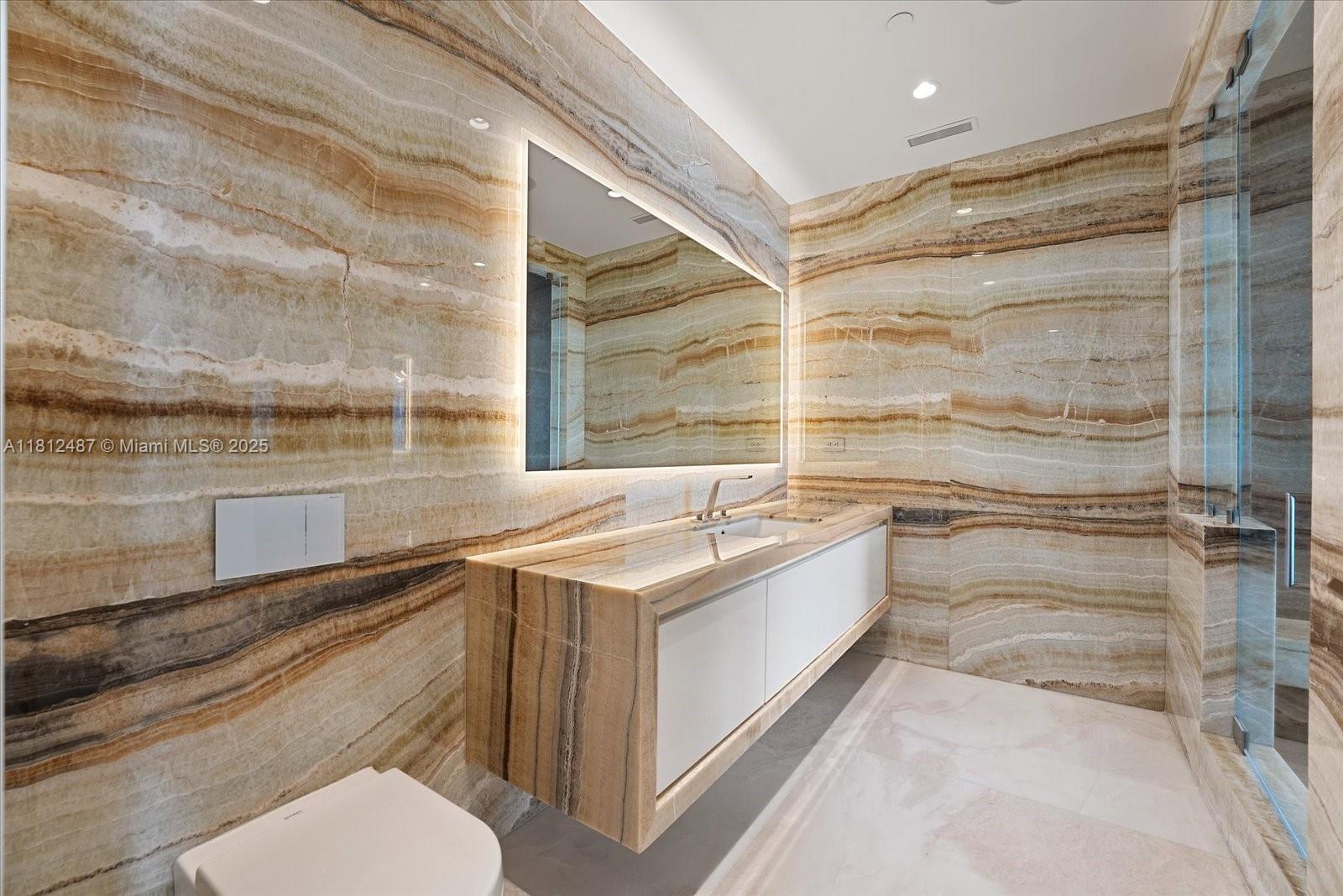 17901 Collins Avenue, Unit 3004 Sunny Isles Beach, FL 33160 - Photo 22 of 61 a bathroom with a sink and a bathtub