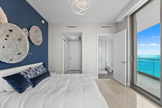 a bathroom with a granite countertop toilet a sink and shower