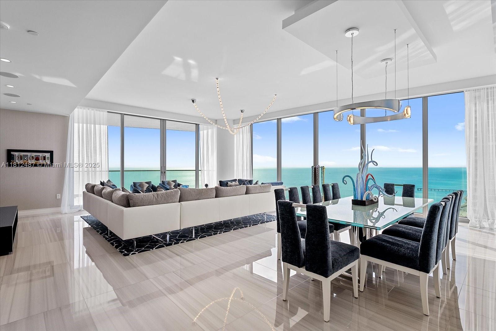 17901 Collins Avenue, Unit 3004 Sunny Isles Beach, FL 33160 - Photo 5 of 61 a living room with furniture and large windows