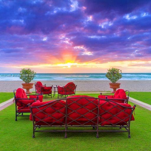 17901 Collins Avenue, Unit 3004 Sunny Isles Beach, FL 33160 - Photo 60 of 61 a view of a yard with furniture and garden