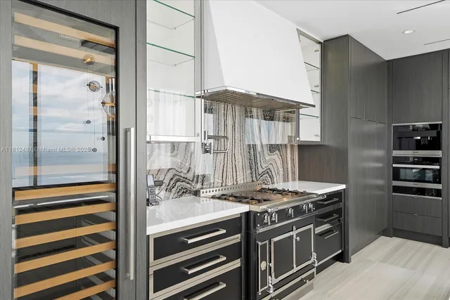 a kitchen with stainless steel appliances a stove and a refrigerator