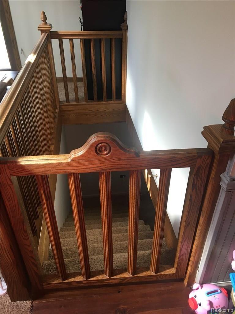 1704 East Linwood Road Linwood, MI 48634 - Photo 20 of 41 Stairs to basement in living room