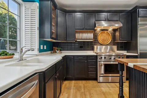 a kitchen with a stove and a sink
