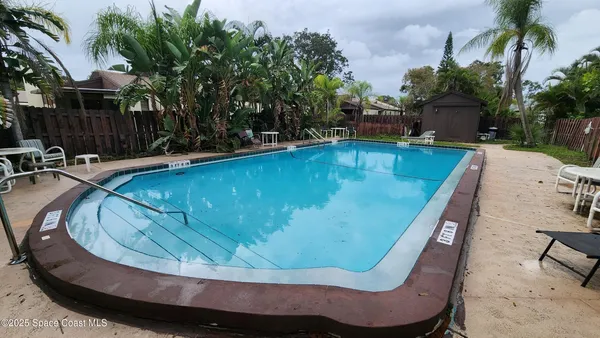 a view of swimming pool having outdoor seating
