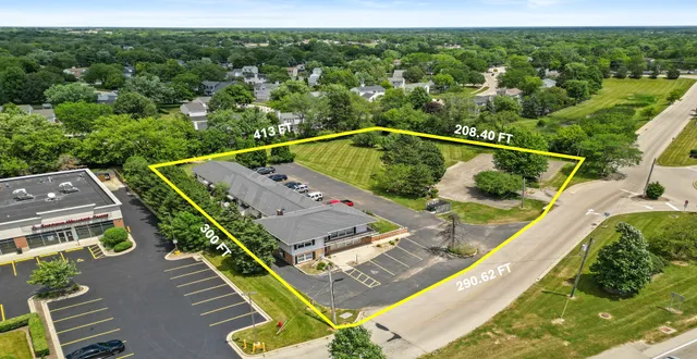an aerial view of a house with a swimming pool